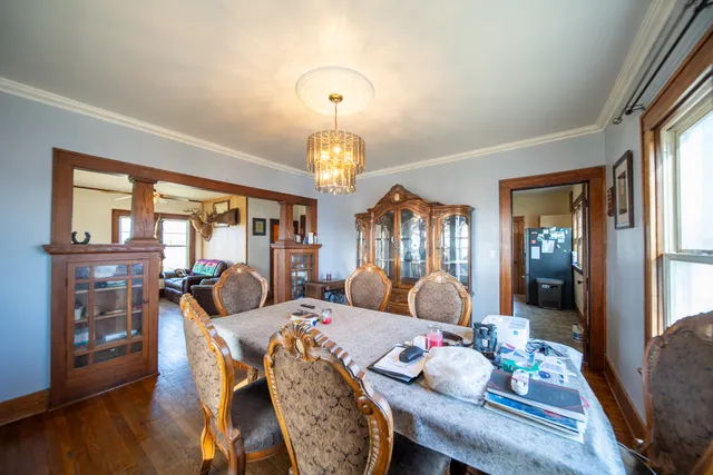 a bedroom with furniture and wooden floor