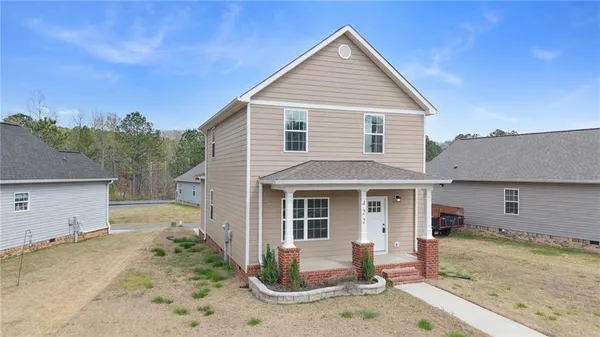 front view of a house with a yard