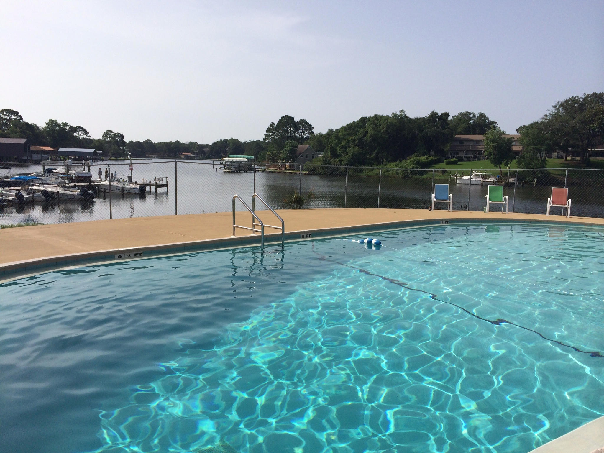 210 Pelham Road, Unit 206C Fort Walton Beach, FL 32547 - Photo 3 of 11 a view of a lake with houses in background