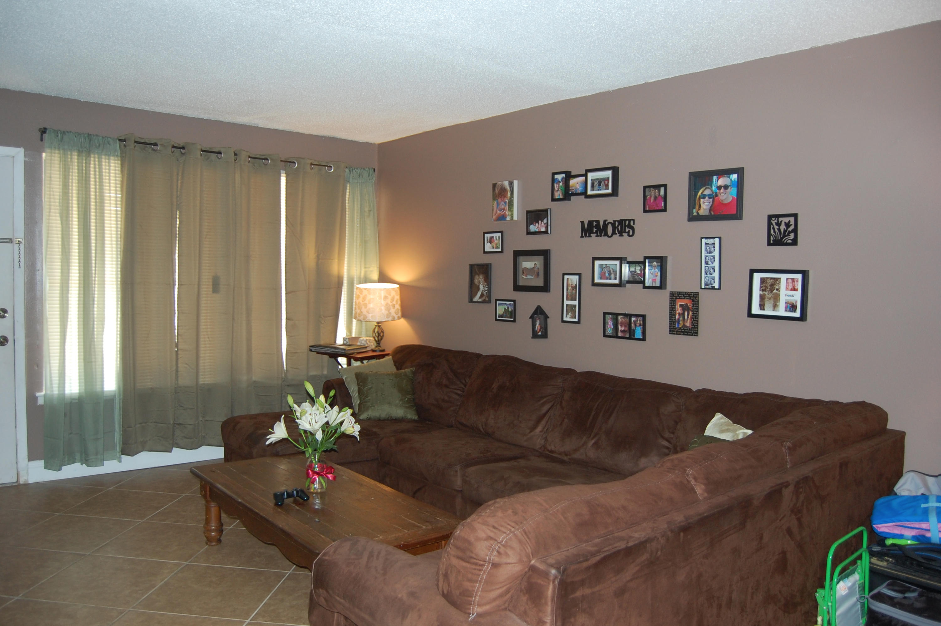 210 Pelham Road, Unit 206C Fort Walton Beach, FL 32547 - Photo 8 of 11 a living room with furniture and window