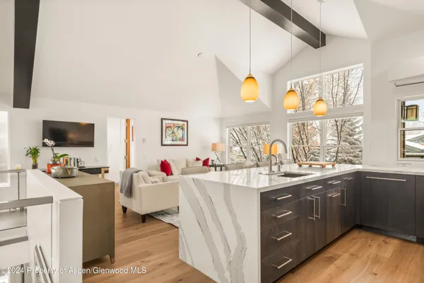 a kitchen with a sink stove and cabinets