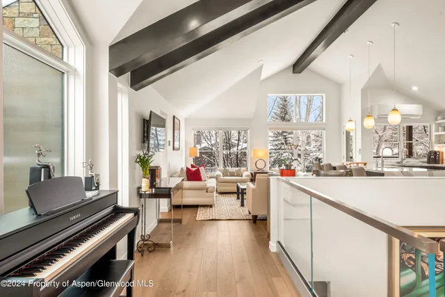 a room with wooden floor and furniture