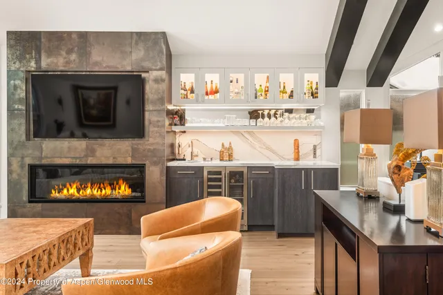 a kitchen with a sink and a stove top oven