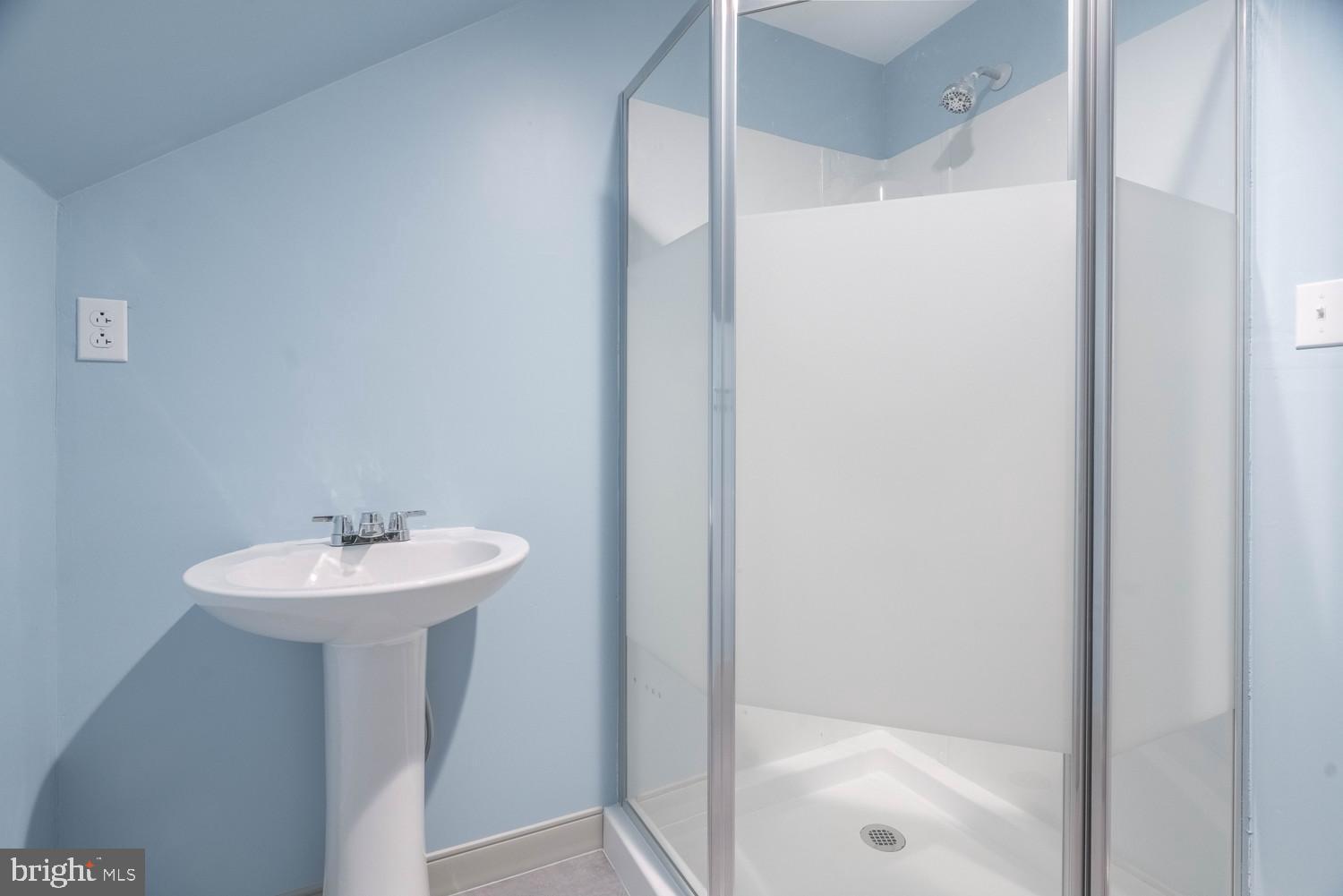 17511 Gay Street Hagerstown, MD 21740 - Photo 21 of 30 a bathroom with a sink a mirror and a shower