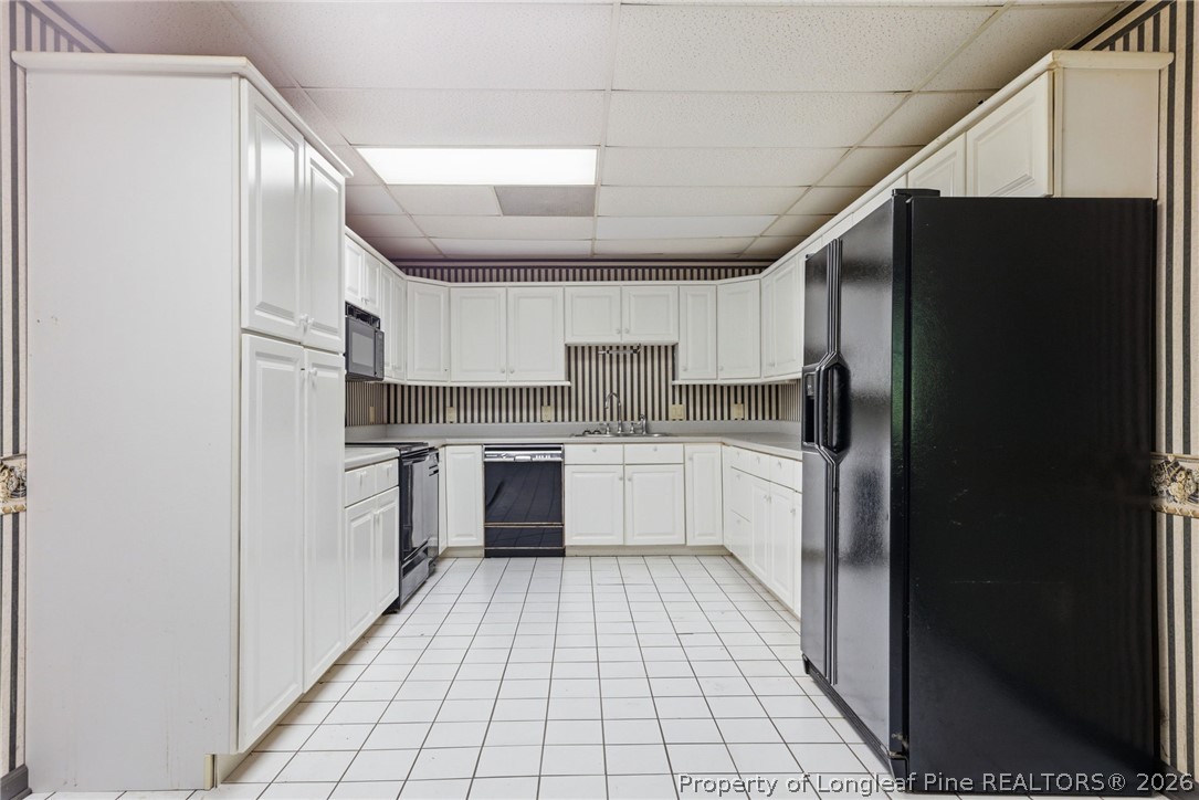 478 Rattlesnake Trail Aberdeen, NC 28315 - Photo 22 of 44 a kitchen with a refrigerator a sink and dishwasher