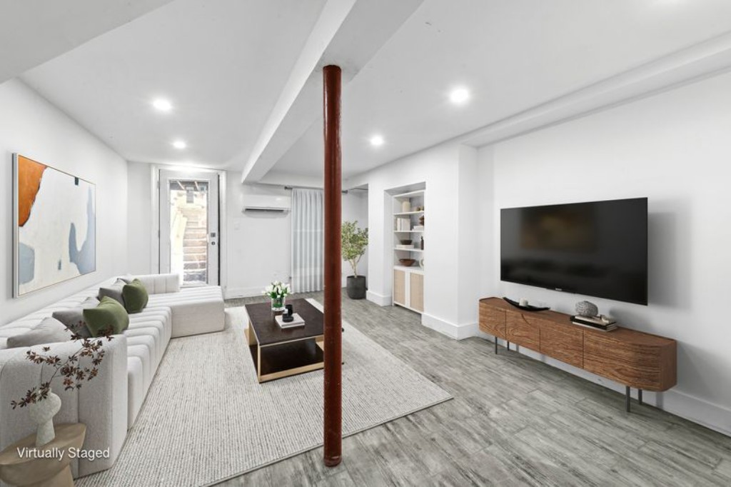 105 St Felix Street, Unit 1 Brooklyn, NY 11217 - Photo 5 of 11 a living room with furniture and a flat screen tv