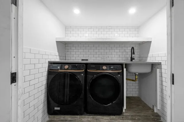 a close view of a utility room with washer and dryer