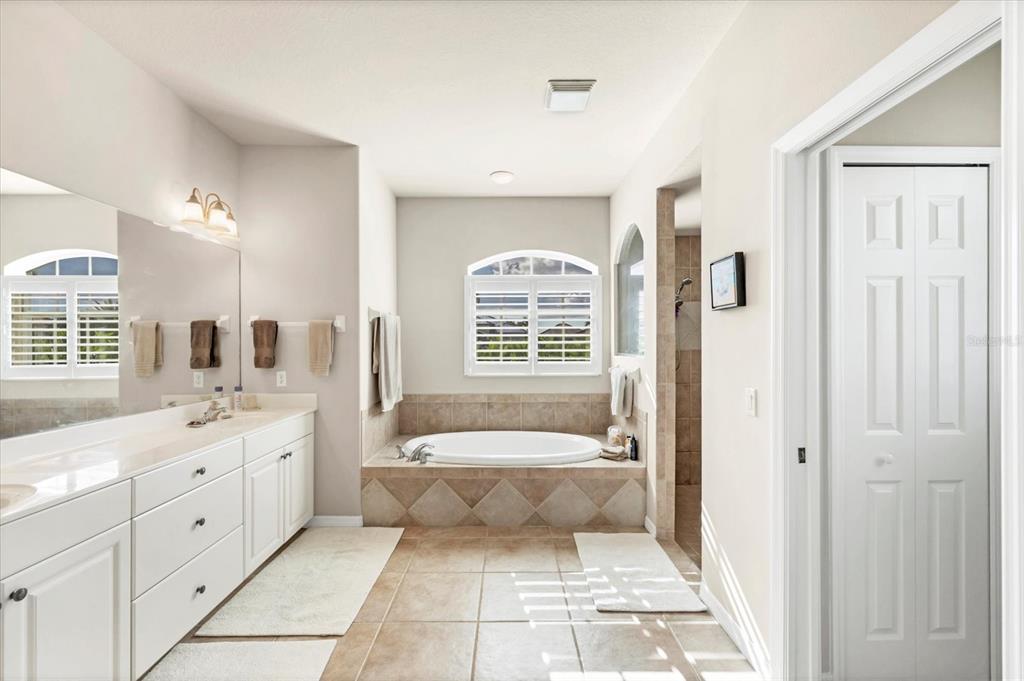 4 Windward Way Placida, FL 33946 - Photo 26 of 39 a bathroom with a tub sink and mirror