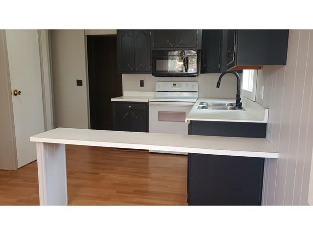 502 South Broad Street Harrison, MI 48625 - Photo 8 of 41 1940628-13713e4f-1240-441b-8c84-5f46c85453ed.JPG