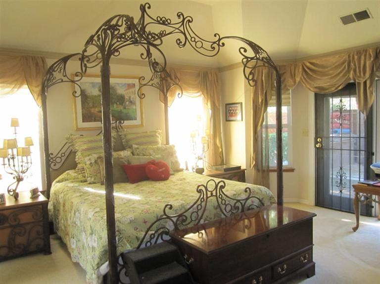 19292 Farallon Road Madera, CA 93638 - Photo 25 of 38 Master bedroom with door to outside spa. Door has security door so that summer breezes can cool off the room at night.