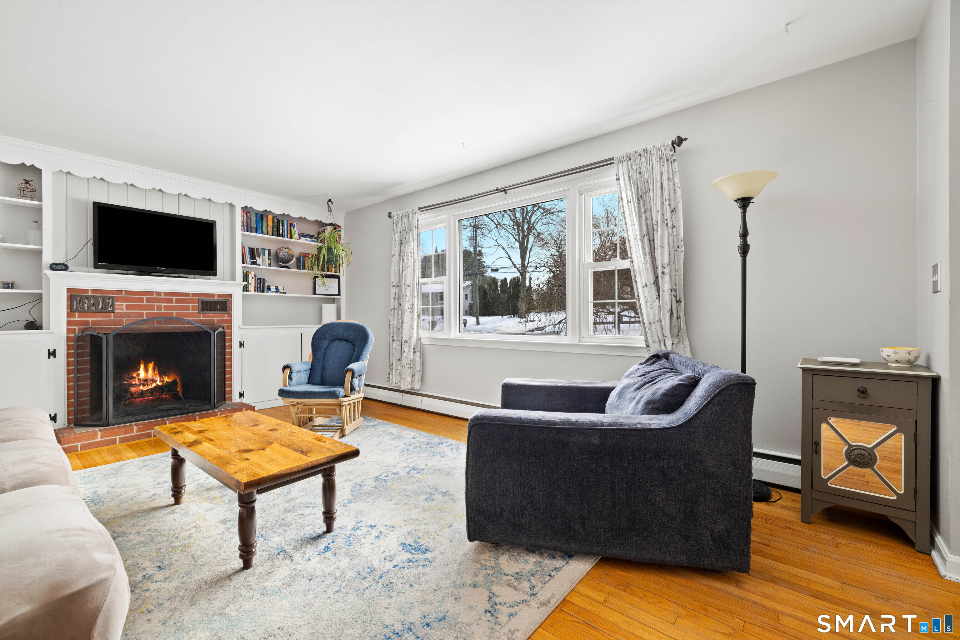 1020 Old Clinton Road Westbrook, CT 06498 - Photo 3 of 30 Living room with wood burning fireplace