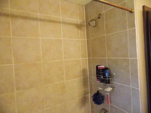 3409 84th Street Lubbock, TX 79423 - Photo 10 of 10 a bathroom with a shower