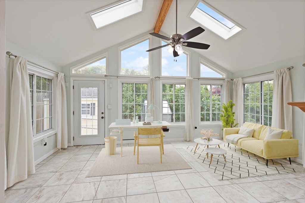 4 Homestead Street Lexington, MA 02421 - Photo 3 of 41 a living room with furniture and floor to ceiling windows
