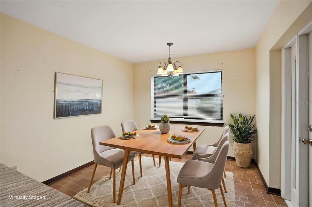 11286 Roland Street Spring Hill, FL 34609 - Photo 20 of 54 a view of a dining room with furniture and window