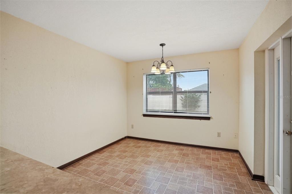 11286 Roland Street Spring Hill, FL 34609 - Photo 21 of 54 a view of an empty room with a window