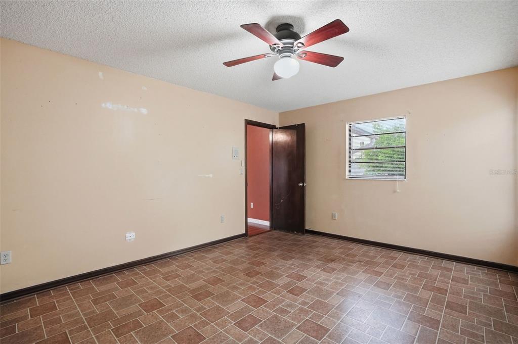 11286 Roland Street Spring Hill, FL 34609 - Photo 23 of 54 a view of an empty room with a window