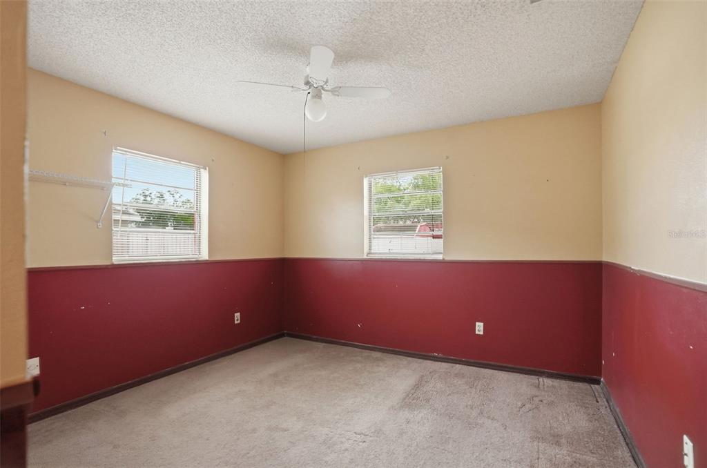 11286 Roland Street Spring Hill, FL 34609 - Photo 27 of 54 a view of room with window and ceiling fan