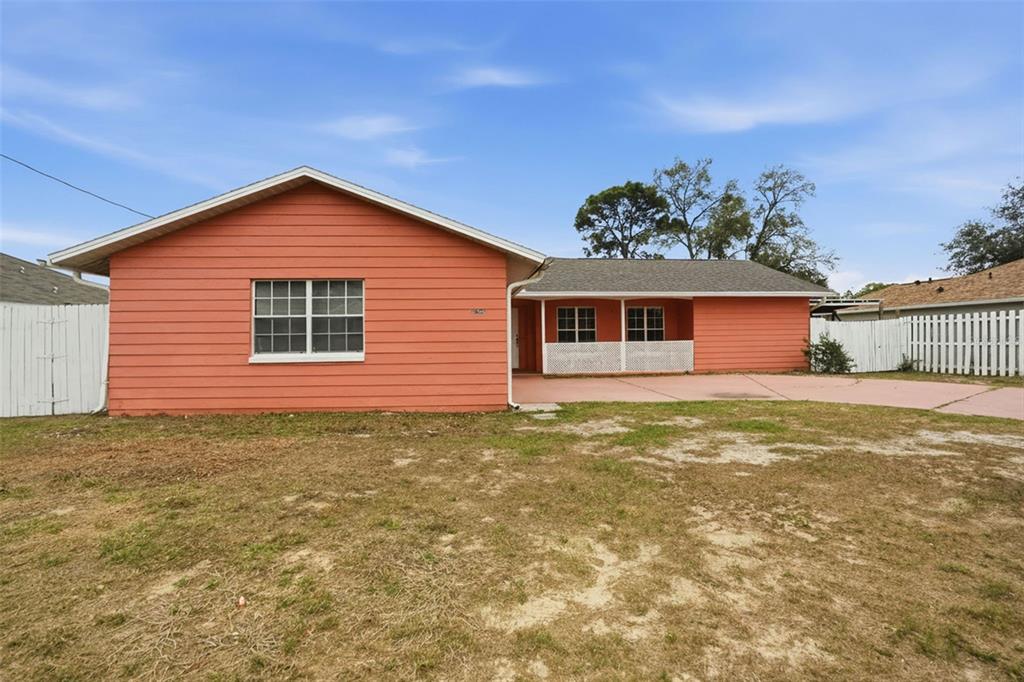 11286 Roland Street Spring Hill, FL 34609 - Photo 3 of 54 a view of a house with a yard