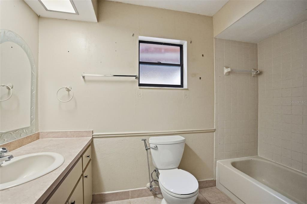 11286 Roland Street Spring Hill, FL 34609 - Photo 31 of 54 a white toilet sitting next to a bath tub