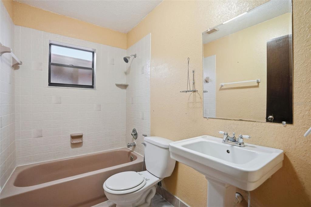 11286 Roland Street Spring Hill, FL 34609 - Photo 34 of 54 a bathroom with a sink toilet and shower