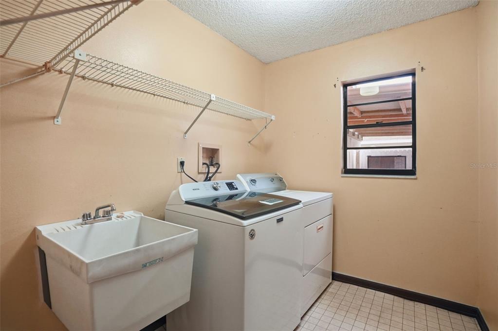 11286 Roland Street Spring Hill, FL 34609 - Photo 35 of 54 a utility room with dryer and washer