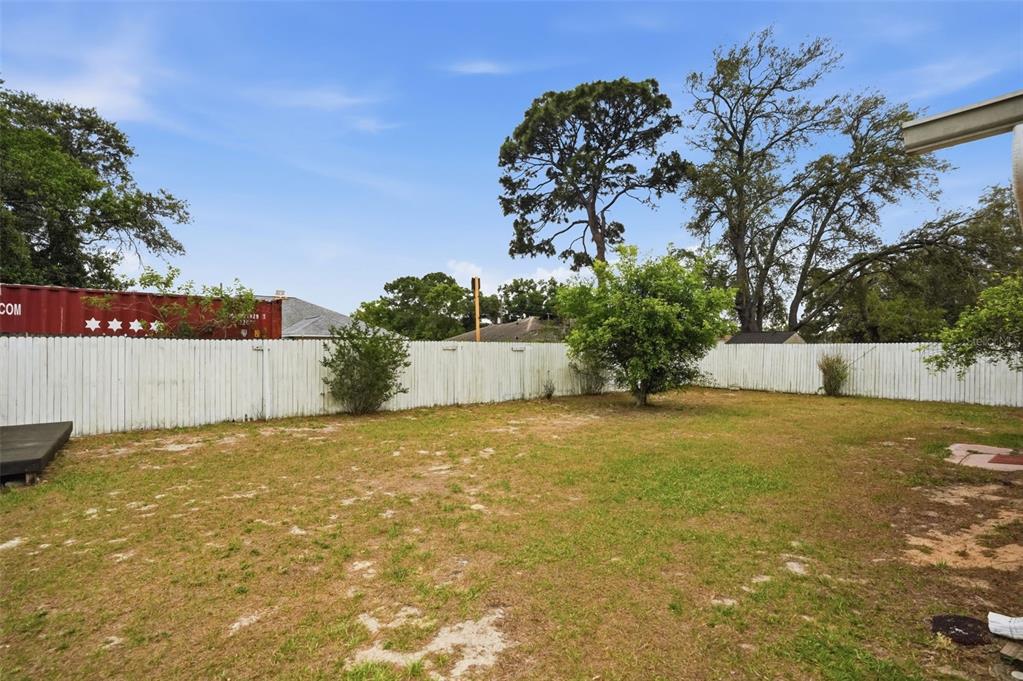 11286 Roland Street Spring Hill, FL 34609 - Photo 37 of 54 a view of a house with a garden