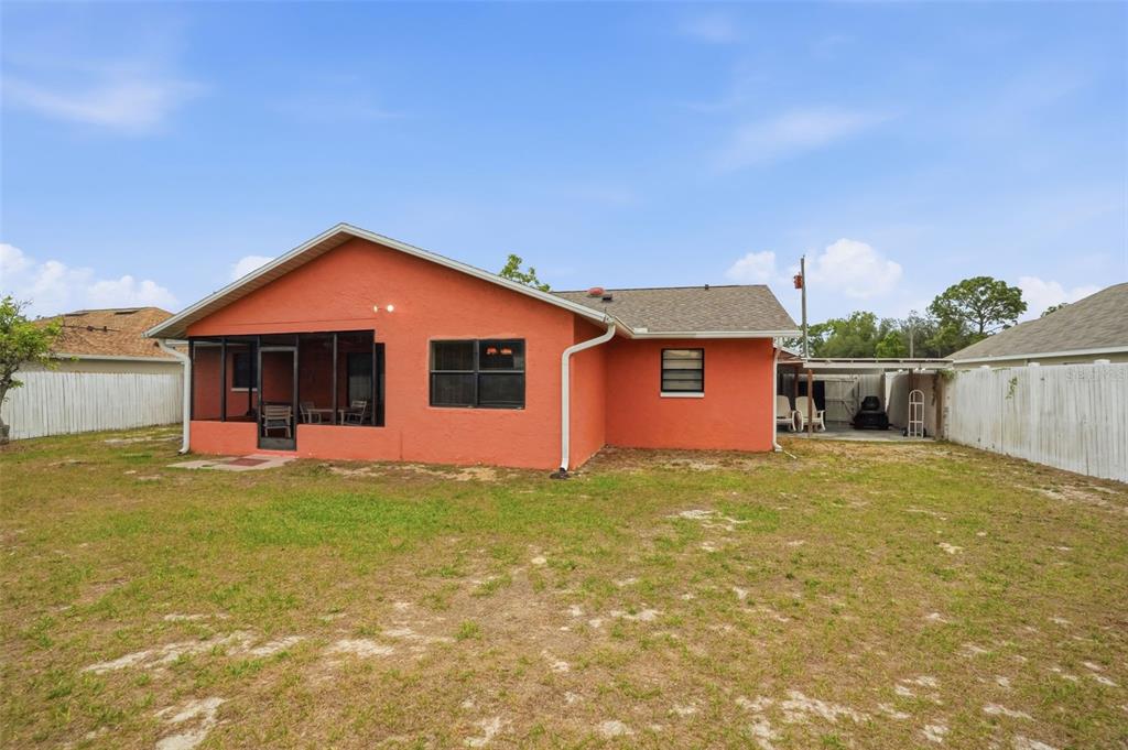 11286 Roland Street Spring Hill, FL 34609 - Photo 39 of 54 a front view of a house with a yard and garage
