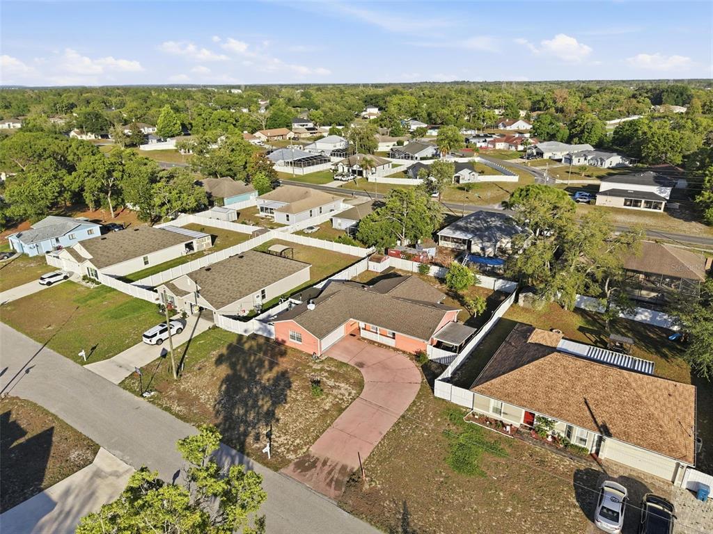 11286 Roland Street Spring Hill, FL 34609 - Photo 46 of 54 an aerial view of residential houses with outdoor space