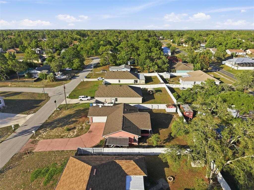 11286 Roland Street Spring Hill, FL 34609 - Photo 47 of 54 an aerial view of residential houses with outdoor space