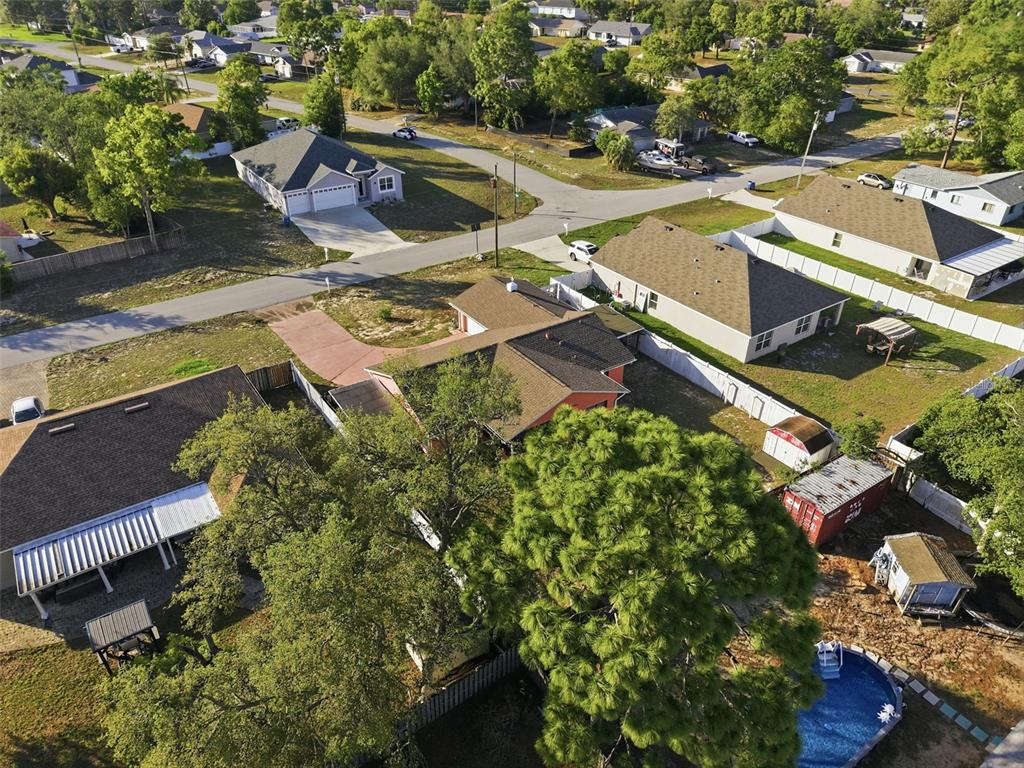 11286 Roland Street Spring Hill, FL 34609 - Photo 48 of 54 an aerial view of a house with a garden