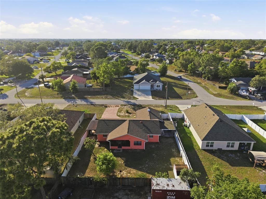 11286 Roland Street Spring Hill, FL 34609 - Photo 49 of 54 an aerial view of residential houses with outdoor space