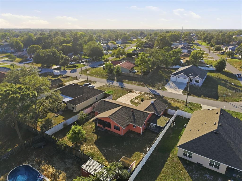 11286 Roland Street Spring Hill, FL 34609 - Photo 50 of 54 an aerial view of residential houses with outdoor space