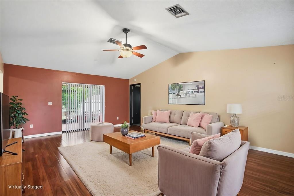 11286 Roland Street Spring Hill, FL 34609 - Photo 5 of 54 a living room with furniture and wooden floor