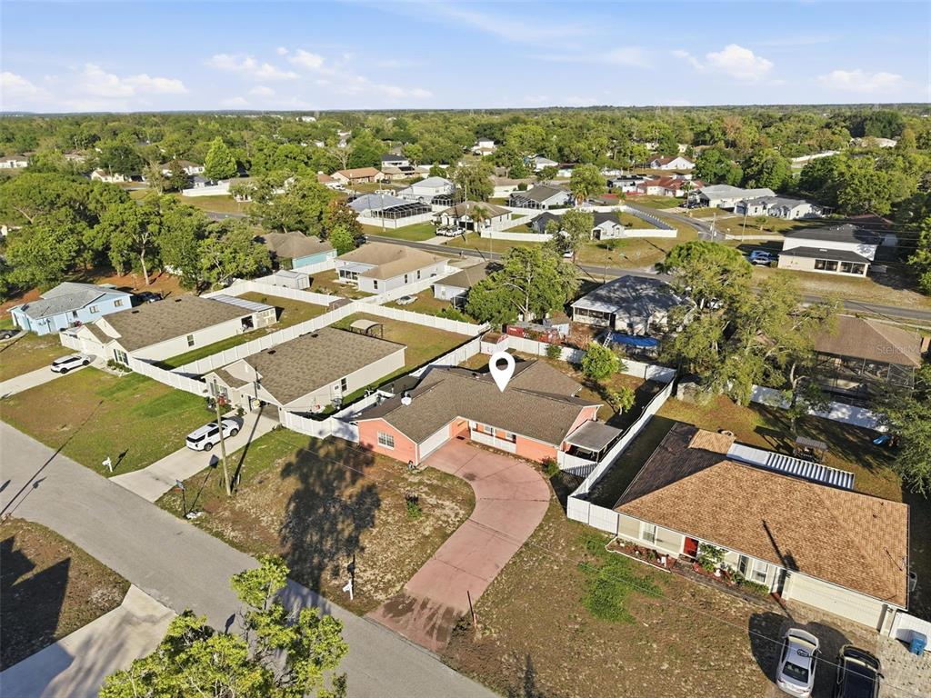 11286 Roland Street Spring Hill, FL 34609 - Photo 53 of 54 an aerial view of residential houses with outdoor space