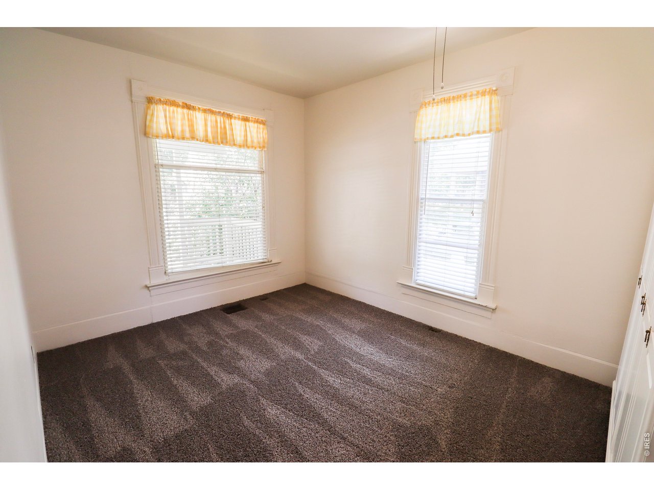 608 South Howes Street Fort Collins, CO 80521 - Photo 14 of 28 a view of an empty room with a window