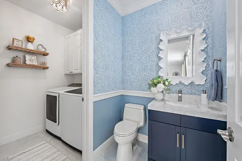 a bathroom with a sink toilet and vanity