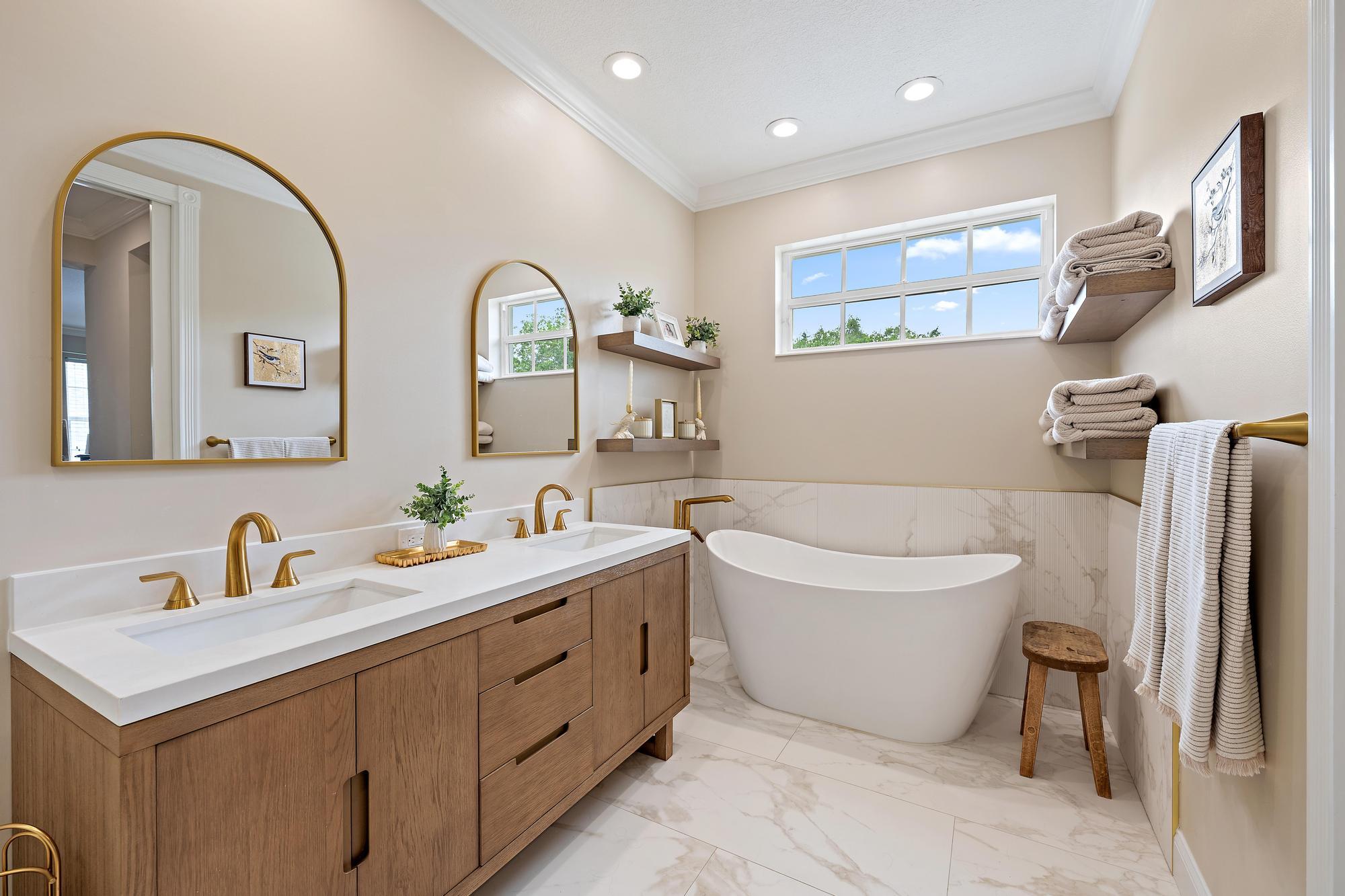 166 Honeysuckle Drive Jupiter, FL 33458 - Photo 14 of 26 a spacious bathroom with a double vanity sink mirror and bathtub