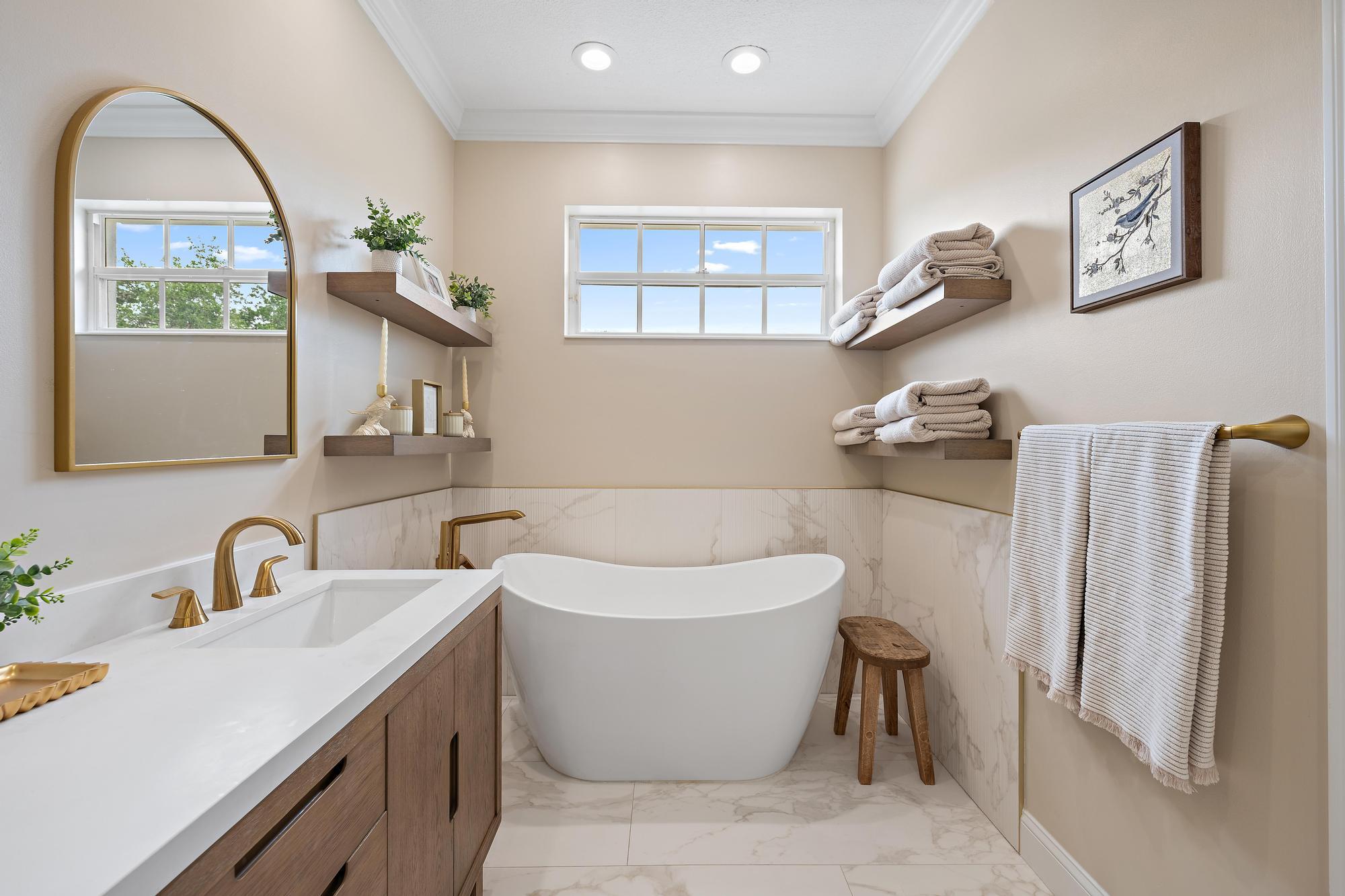 166 Honeysuckle Drive Jupiter, FL 33458 - Photo 16 of 26 a white bath tub sitting next to a white sink