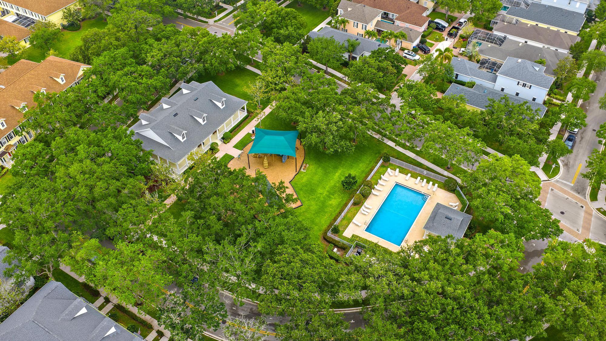 166 Honeysuckle Drive Jupiter, FL 33458 - Photo 26 of 26 an aerial view of a house with pool yard and outdoor seating
