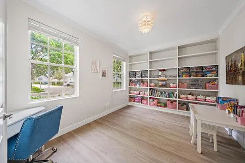 a room with furniture and a book shelf