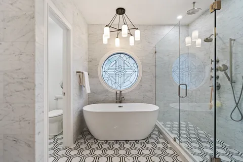 a bathroom with a bathtub and a shower