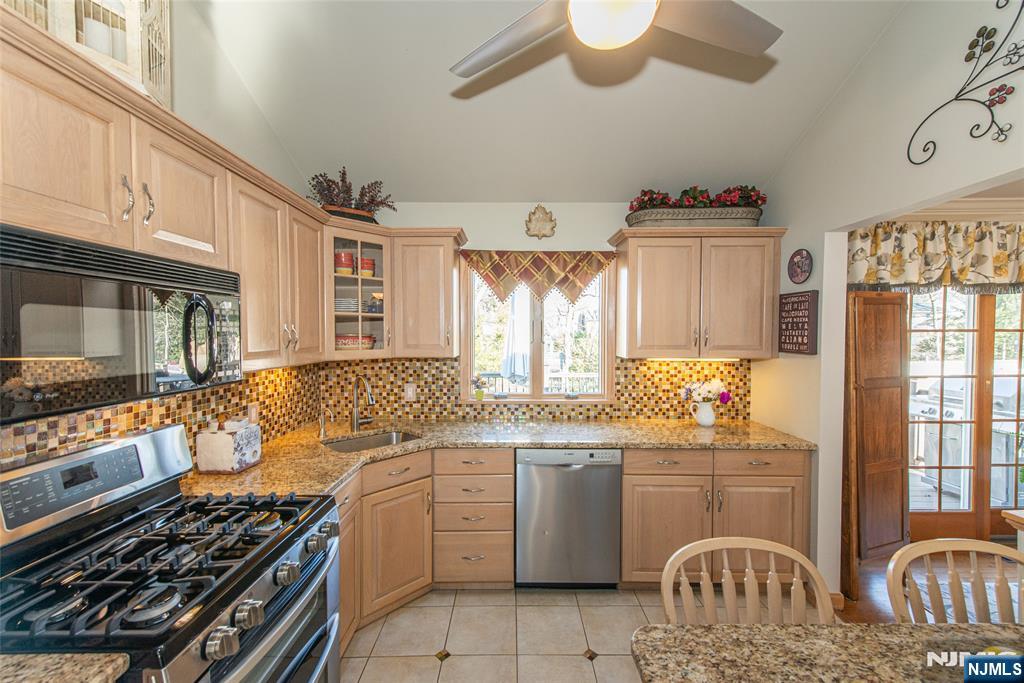 3 Springdale Road West Caldwell, NJ 07006 - Photo 17 of 38 a kitchen with a sink stove and window