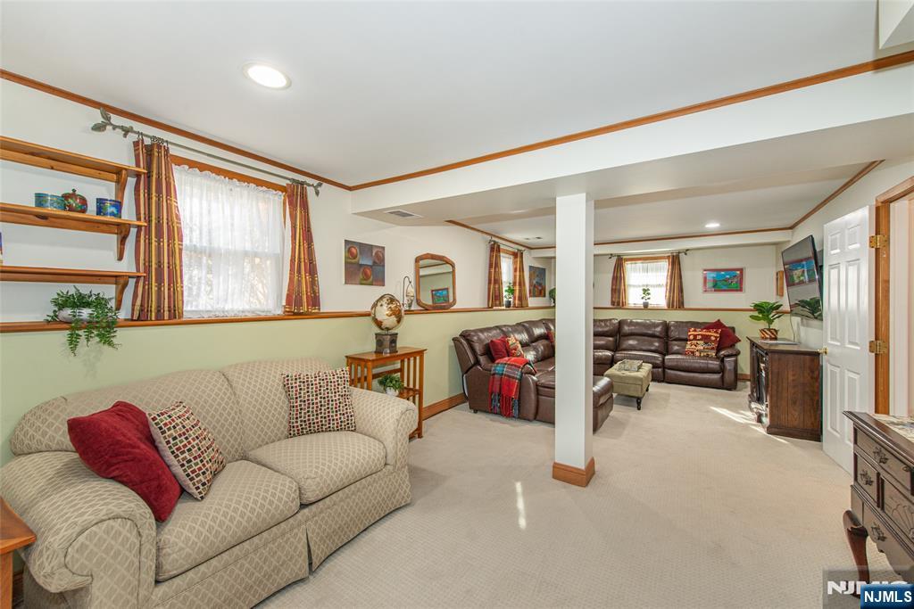 3 Springdale Road West Caldwell, NJ 07006 - Photo 29 of 38 a living room with furniture and a flat screen tv