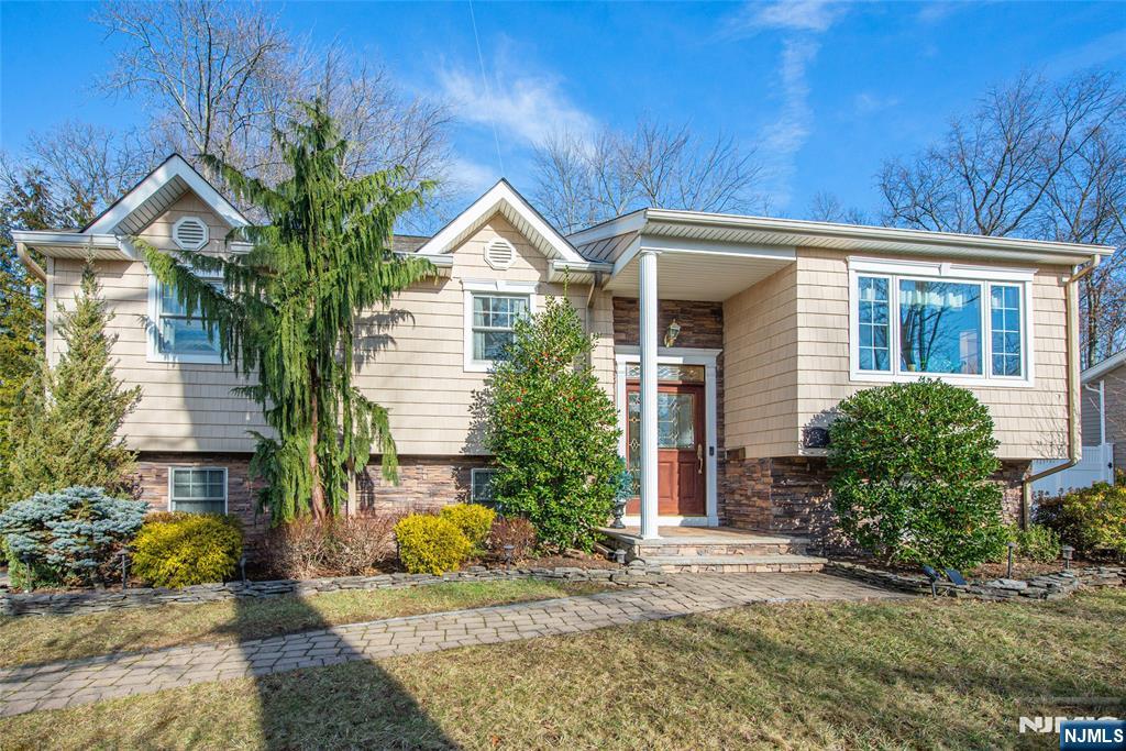 3 Springdale Road West Caldwell, NJ 07006 - Photo 3 of 38 a front view of a house with garden