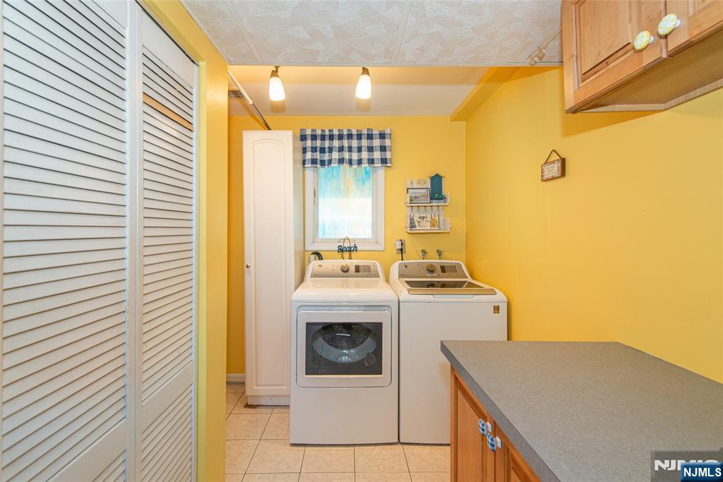 3 Springdale Road West Caldwell, NJ 07006 - Photo 31 of 38 a utility room with dryer and washer