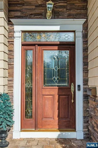 a view of a door of the house with a window
