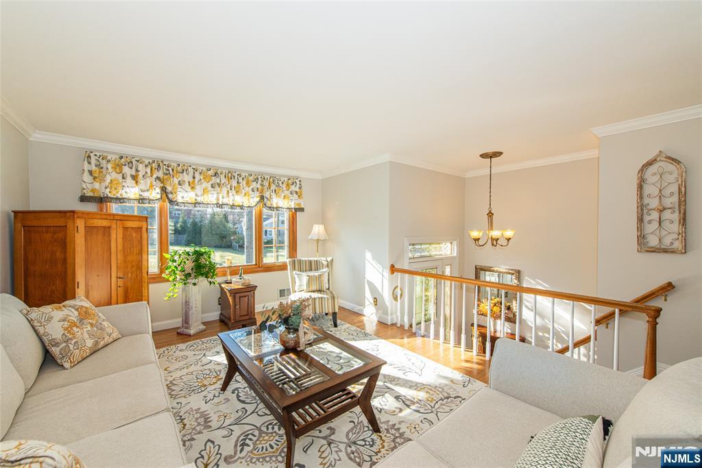 3 Springdale Road West Caldwell, NJ 07006 - Photo 7 of 38 a living room with furniture and a large window