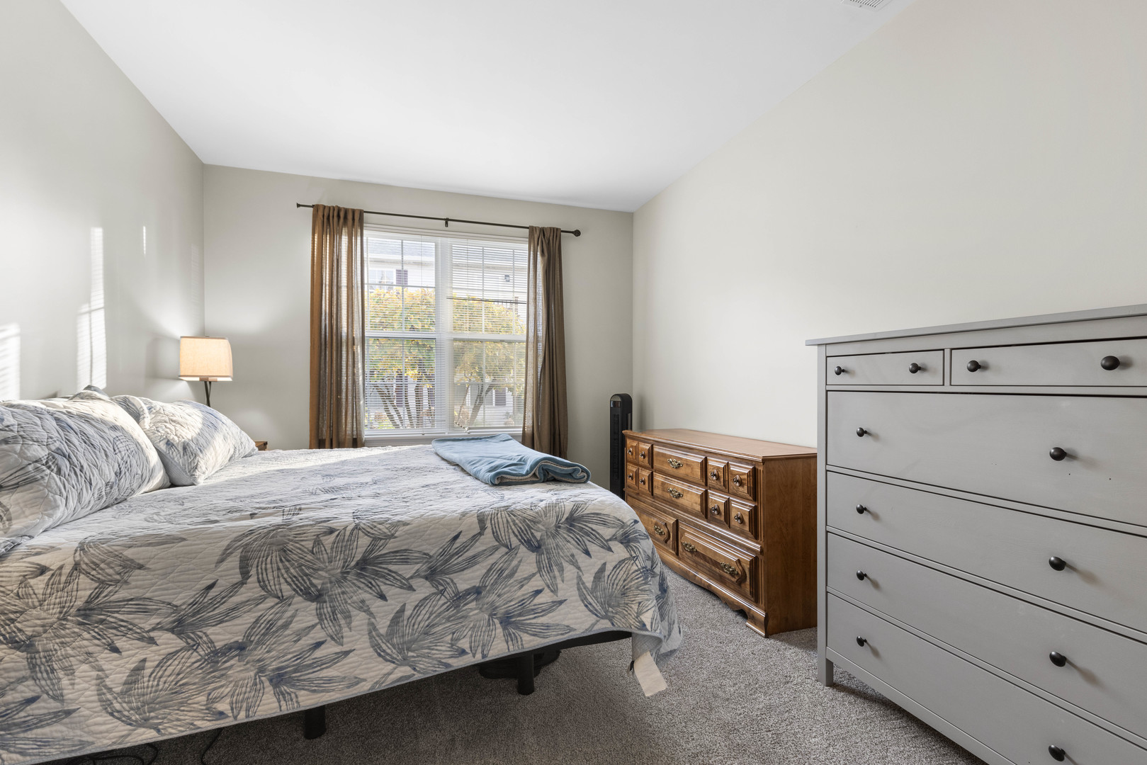 3133 Falling Waters Lane Lindenhurst, IL 60046 - Photo 11 of 15 a bedroom with a bed and a window