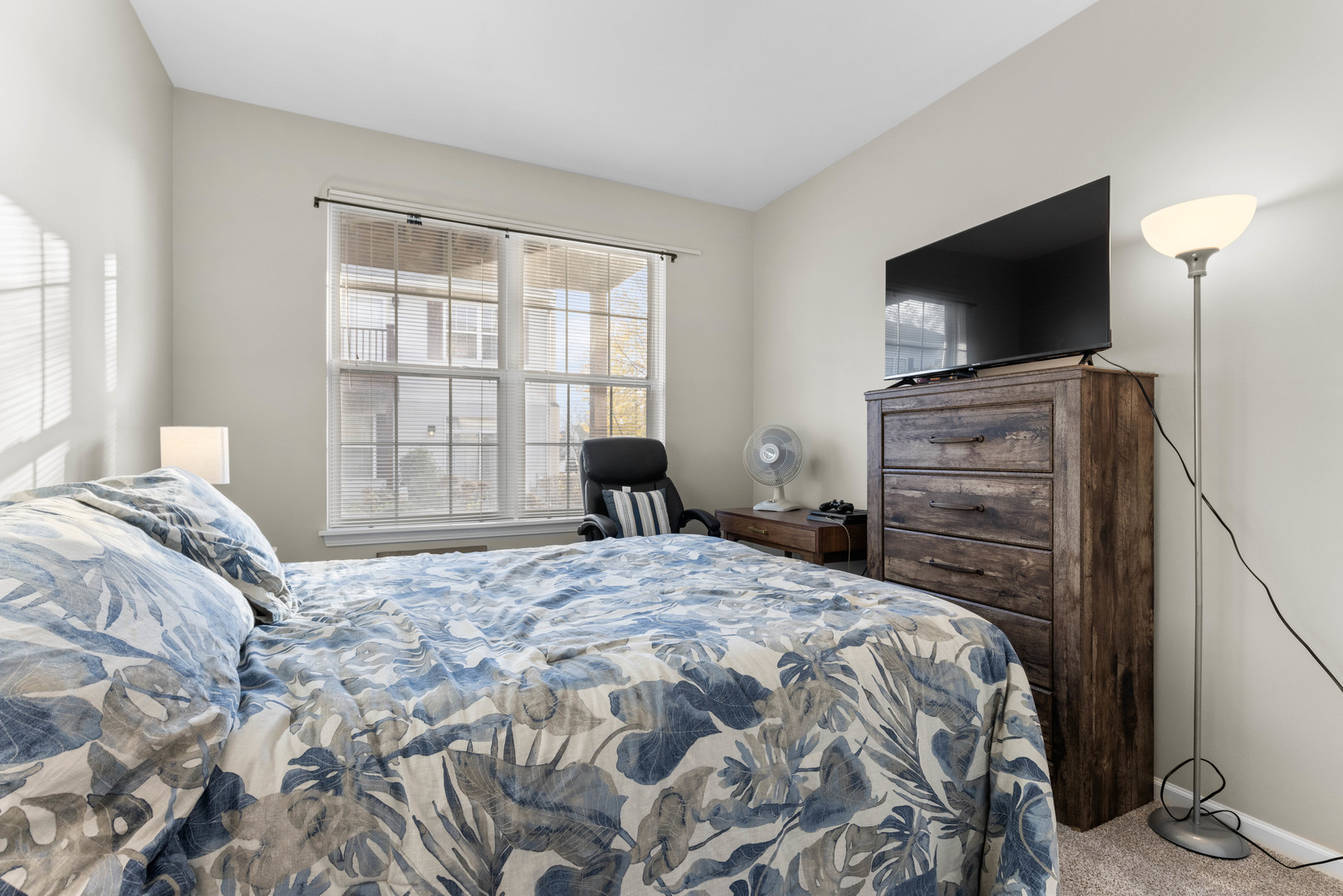 3133 Falling Waters Lane Lindenhurst, IL 60046 - Photo 12 of 15 a bedroom with a bed and a flat screen tv