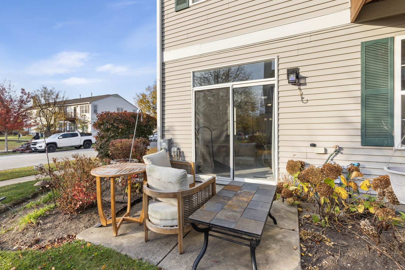 3133 Falling Waters Lane Lindenhurst, IL 60046 - Photo 15 of 15 a view of a patio with table and chairs and potted plants